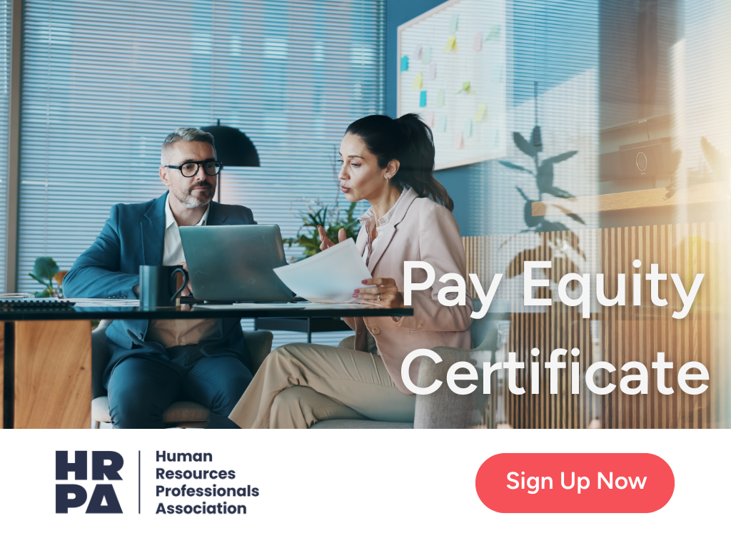 Two professionals sitting at a desk reviewing documents and a laptop, with text reading “Pay Equity Certificate” and the HRPA logo.