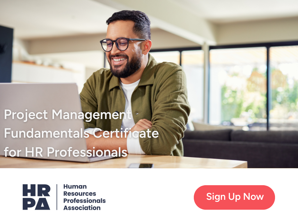 A smiling man wearing glasses works on a laptop at a desk in a bright, modern home. Text on the image reads: “Project Management Fundamentals Certificate for HR Professionals.” HRPA logo appears at the bottom with a red button labeled “Sign Up Now.”